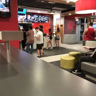 Kids waiting for help, no one at the counter.