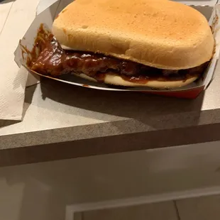 a sandwich in a box on a counter