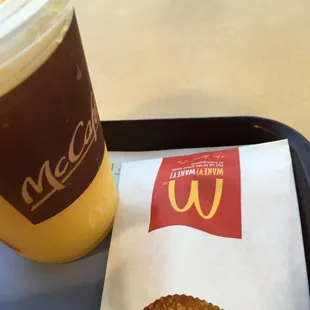 a sandwich and drink on a tray