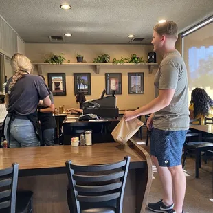 A customer pays his tab.