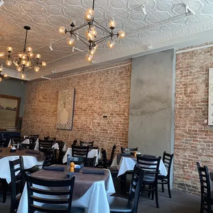 a dining room with tables and chairs