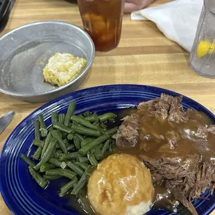Pot roast, mashed potatoes, green beans, and cornbread!! Fabulous!!