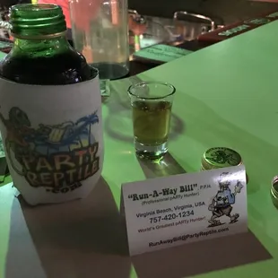 a bottle of alcohol and a card