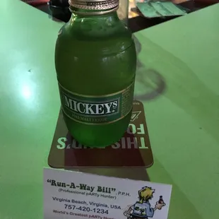 a bottle of green liquid