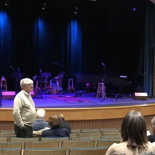 a man standing in front of a stage