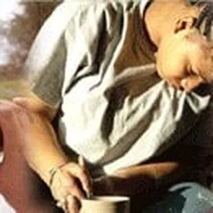 a man taking a picture of a group of children