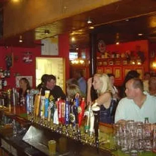 a large group of people at the bar