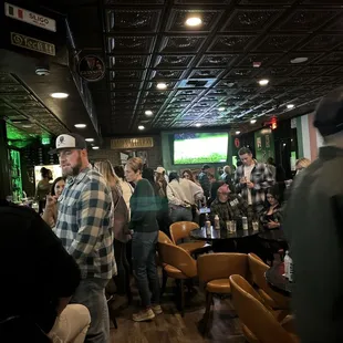 a crowd of people at a bar