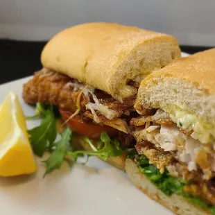 a chicken sandwich with lettuce and tomato