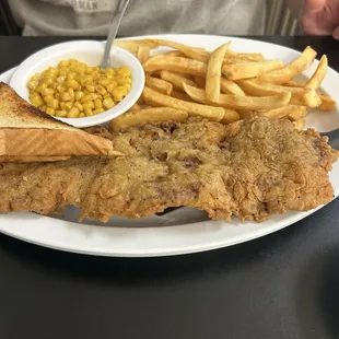 Chicken fried steak gravy on side.