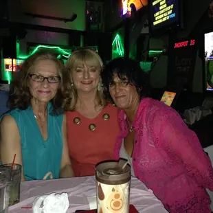 three women sitting at a table