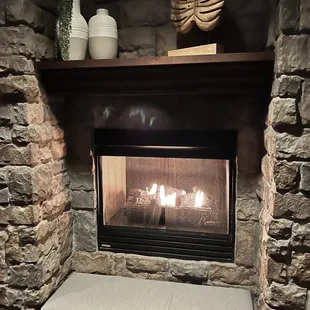a fireplace in a stone fireplace
