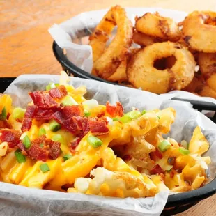 a plate of fries and a bowl of fries