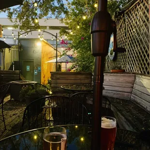 a pint of beer on a patio table