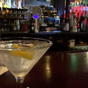 a martini with a lemon wedge
