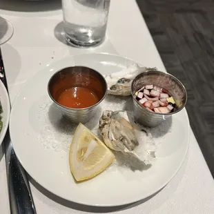 Oysters on the half shell with basically hot sauce