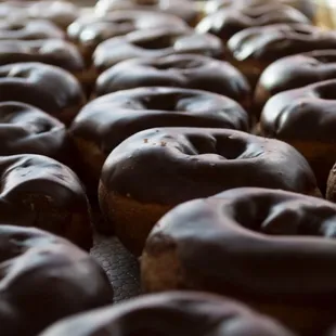 a variety of chocolate donuts