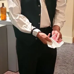 A card dealer, all dressed up! He was very nice and told us about the card rooms they had in the 1800&apos;s in Modesto.