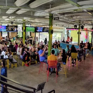 A panoramic shot of the main level. Food caravan to the left.