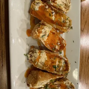 These poppers are seriously addicting-cream cheese, bacon, jalapeños drizzled with a honey sriracha sauce