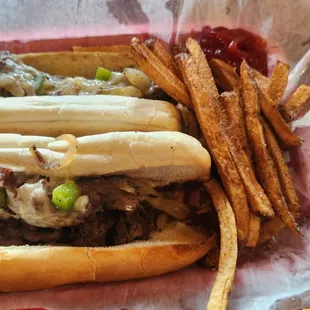 Philly steak sub with fries.