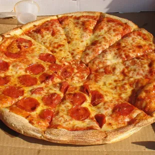 a pepperoni pizza in a box