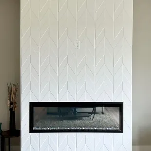 Floor to Ceiling tile on the fireplace.