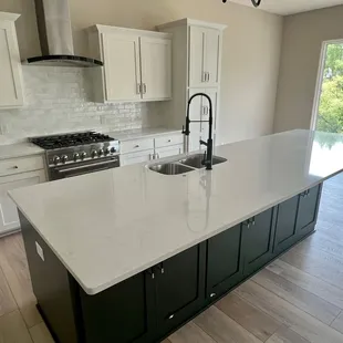 Flooring, Countertops and backsplash tile by McKean's