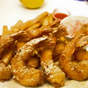 a plate of fried fish and fries