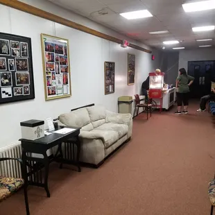 Near the entry to the auditorium with a small concessions and waiting area