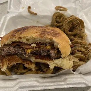 Cheeseburger with bacon on jalapeño sourdough bun with fried jalapeños on the side