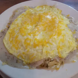Breakfast bowl: biscuit, hash browns, egg, cheese, sausage gravy. Bad light- looks better in person. And it was huge!