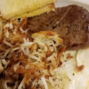 Steak eggs and burnt hash browns