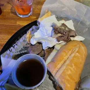 a roast beef sandwich and a pickle