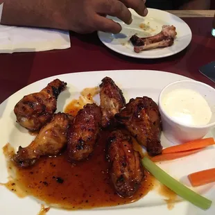 Thai Chili wings.... Delicious. Not spicy but good flavor and juicy wings.