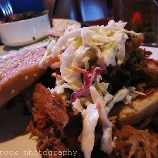 a pulled pork sandwich and coleslaw
