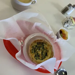 $9.50 quiche w/ fruit salad side and $4.00 Wisconsin Cheddar soup.