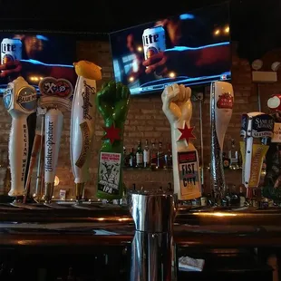 a row of beer taps