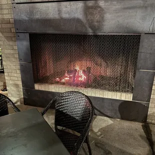 Awesome fireplace on outside covered patio