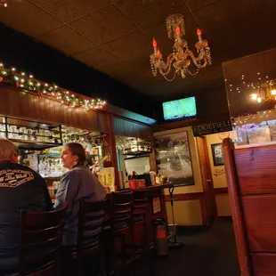 two men sitting at the bar