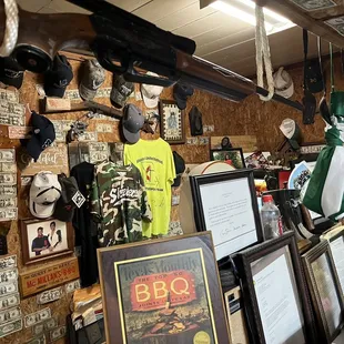 a wall full of hats and memorabilia