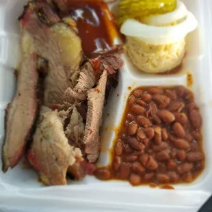 a styrofoam container of food