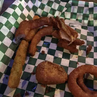 "Onion rings", zucchini and jalapeño poppers. Fried to a golden black.
