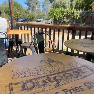 Outside patio seating with water mist and scenic views.