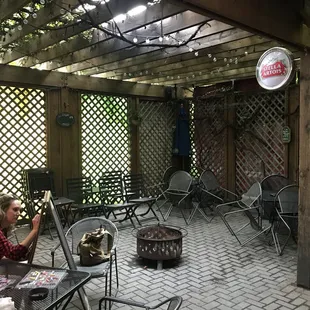 a man sitting at a table outside