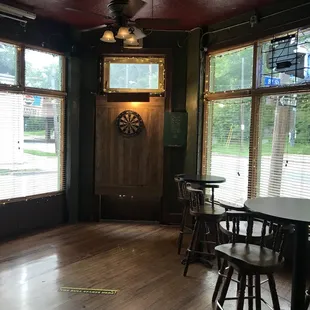 a dining room with a clock on the wall