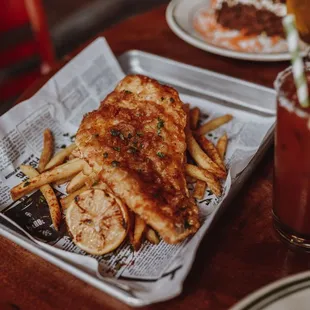 a plate of chicken and french fries
