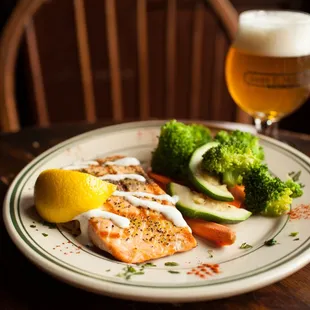 a plate of food and a glass of beer