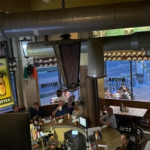 people sitting at tables in a restaurant