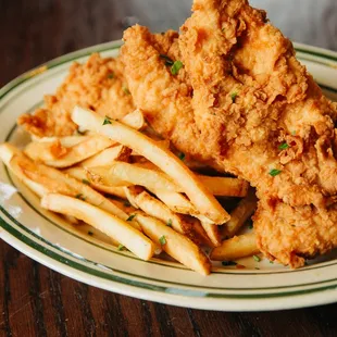 a plate of fried chicken and french fries